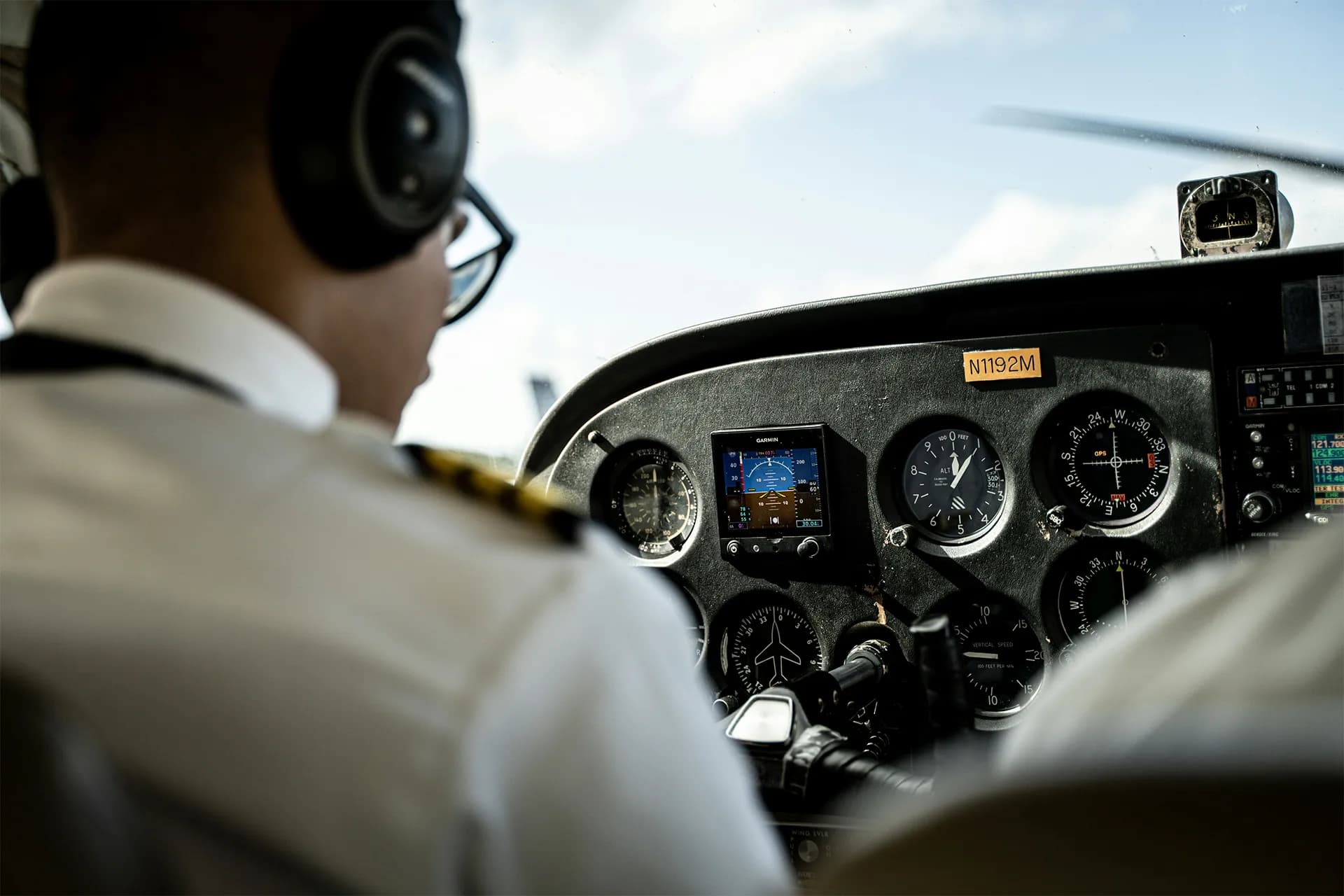 Pilot looking at checklist
